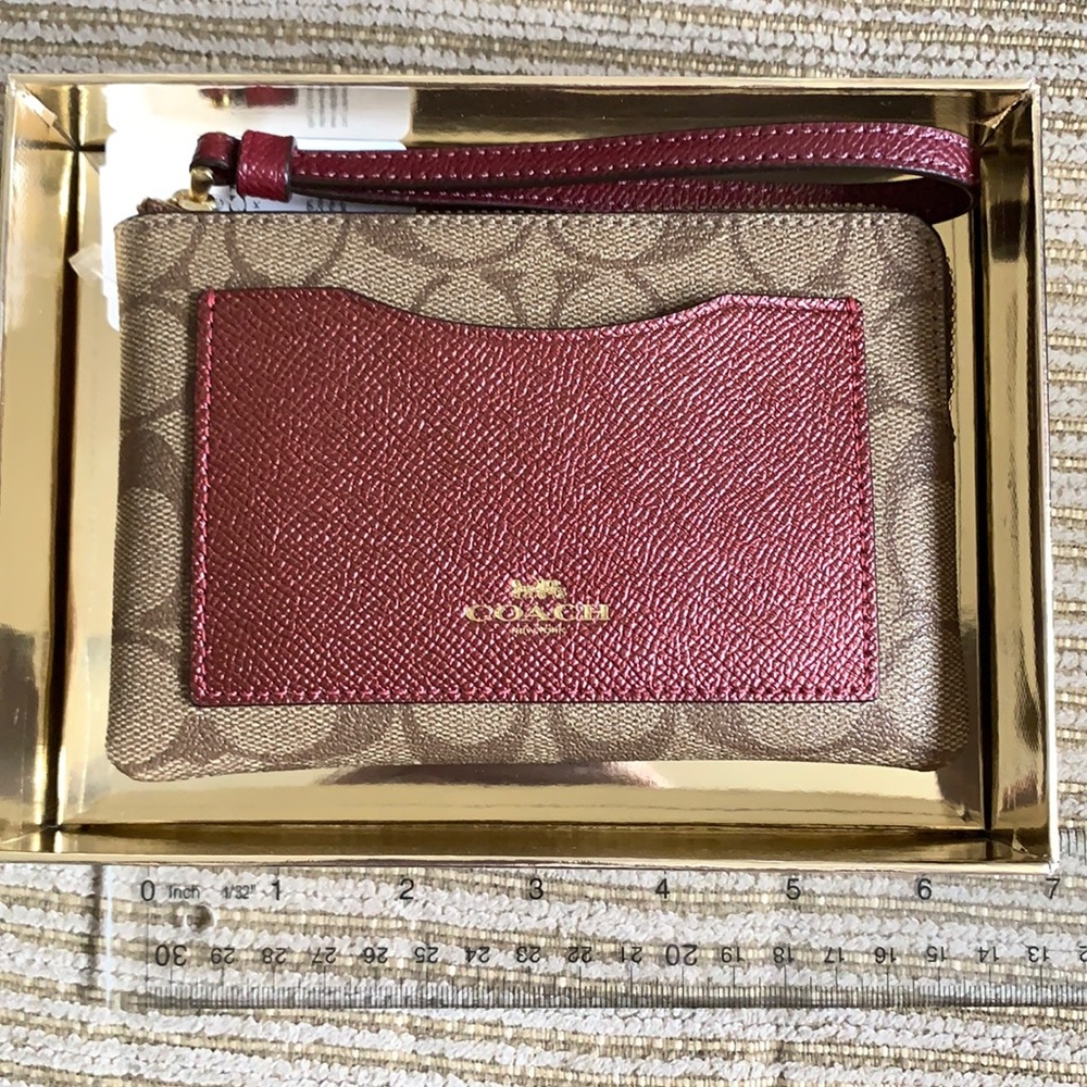 Coach Wristlet. Khaki and metallic cherry.